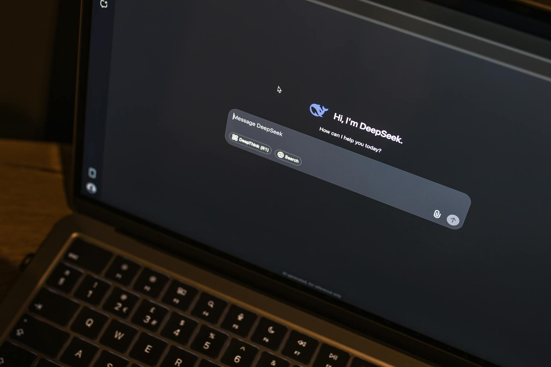 laptop displaying ai chat interface at night